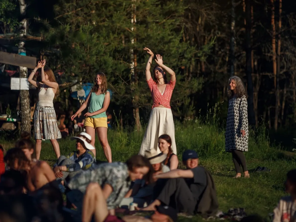 People gathering at Joginės in nature